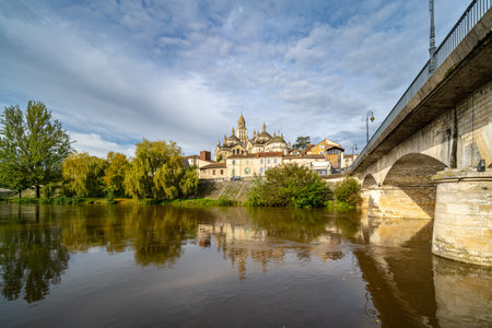The St. Front Cathedral of Perigueux seen from the edges of the l'Isle River, located in Dordogne, France. Taken during a partly overcast autumn day with no peopleの写真素材