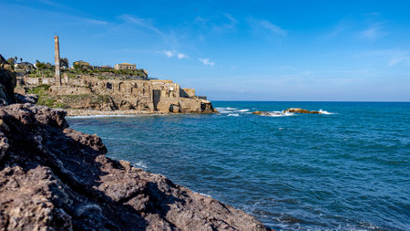 Vecchia Tonnara of Portopalo di Capo Passero, Sicily, seen from the sea shore on a sunny winter day with no people.の写真素材