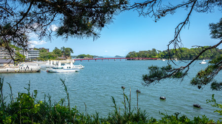 Access red bridge to one of the Island of the bay of Matsushima, Japan, taken in springtime with no people.の写真素材