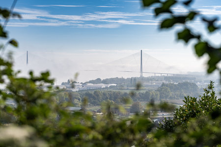 The bridge of Normandy taken from a hill near Honfleur in Normandy, on a foggy yet sunny early...