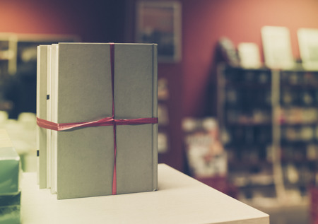 Books gift in a bookstore. Books on shelf on backgroundの写真素材