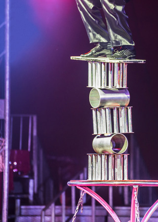 Circus  equilibrist artist balancing on rings. Circus arena.の写真素材