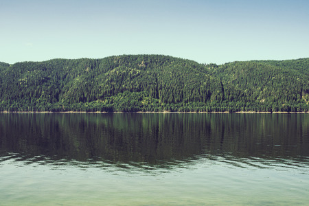 Mountain lake early in the morning. Water vaporの写真素材