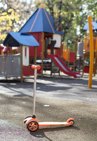  Orange color scooter in playgroundの写真素材
