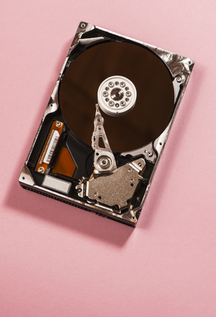 Open hard disc on pink backgroundのeditorial素材