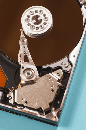 Open hard disc on blue background