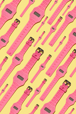 Bright colour hand pink clock pattern on yellow background