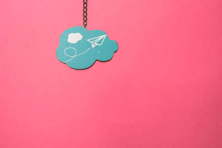 Blue cloud shape on pink background
