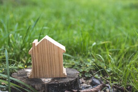 Small wooden house in garden. House shape.の写真素材