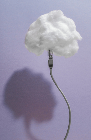 Clouds conception with cotton cloud and USB cableの写真素材