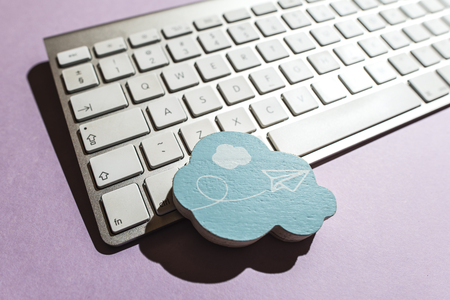 Cloud figure and keyboard on violet 
