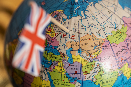 UK concept targeting Russia. British flag pricked on Russia on globe. The United Kingdom focused on Russia on the map.の写真素材