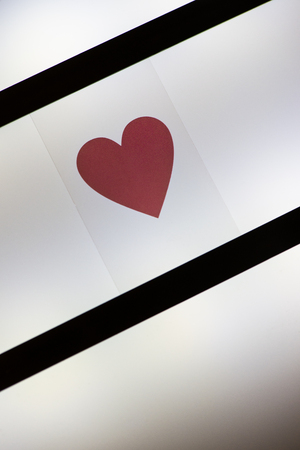 Heart shape on back light. Love and valentineâs day concept. Illuminated backgroundの写真素材