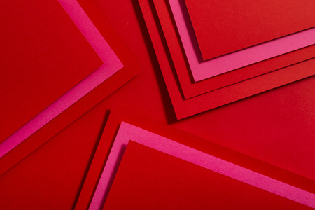 Red paper material design. Geometric unicolour shapes. Wallpaper design background.