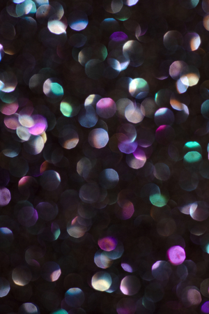 Bokeh multi coloured background. Dark bokeh many colours.の写真素材