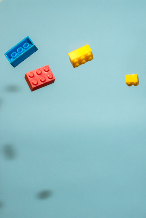 Floating Plastic geometric cubes in the air. Construction toys on geometric shapes falling down in...
