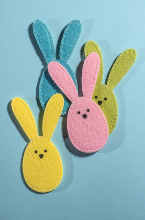 Easter bunnies on bright blue background.の写真素材