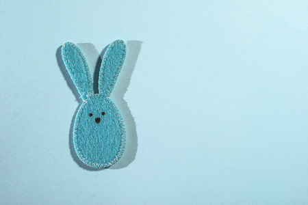 Easter bunny on bright blue background.の写真素材