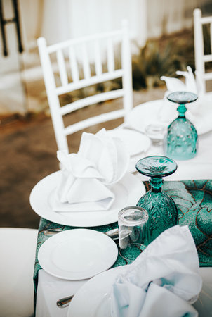 Tables set on event party or wedding reception. Luxurious and elegant table setting feature.の写真素材