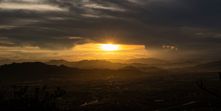 Sunset in the mountains. Panoramic view of the city.の写真素材