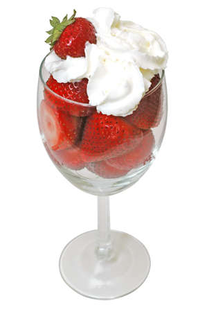 Strawberries and whipped cream in glass.  Isolated on white background の写真素材