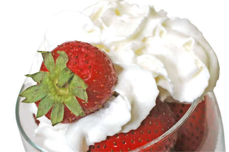 Strawberries and whipped cream in glass.  Isolated on white background の写真素材