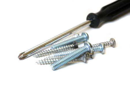 Screwdriver and screws isolated on white background.  の写真素材