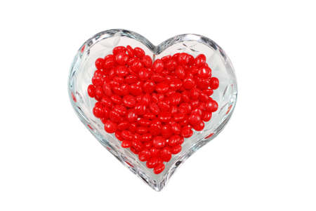 Red Cinnamon Candy in Heart Shaped Bowlの写真素材