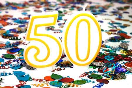 Number 50 celebration candle with confetti.の写真素材