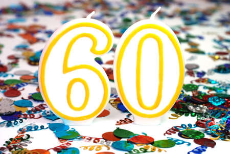Number 60 celebration candle with confetti.の写真素材