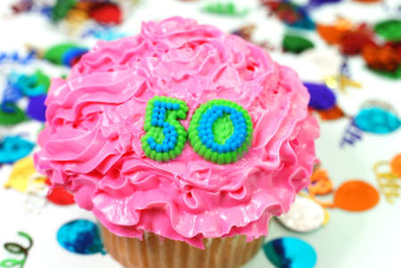 Number 50 celebration cupcake with confetti.の写真素材