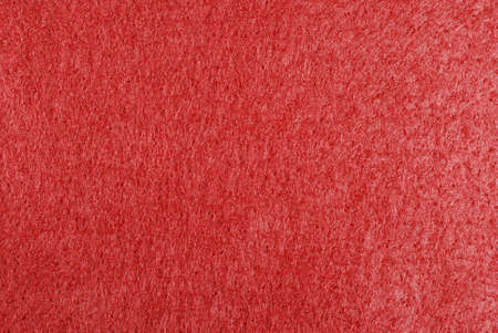 Macro of red felt fabric for background use.の写真素材