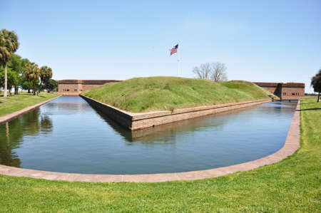 Moat surrounding Fort Pulaski, Georgia with American flag.  の写真素材
