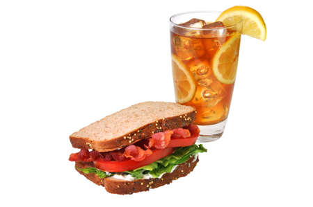 Bacon, lettuce, and tomato sandwich with iced tea with lemons. Isolated on white background with path.の写真素材