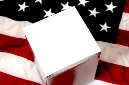 Blank white box with copy space sitting on American Flag.