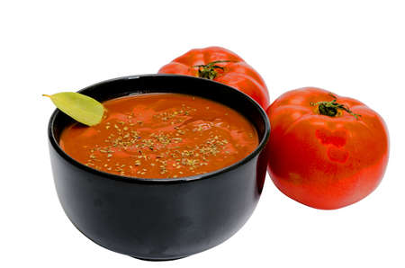Bowl of tomato soup and tomatoes isolated on white background with clipping path.の写真素材
