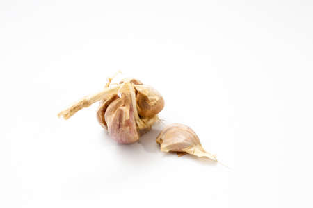 cloves of garlic on a white background