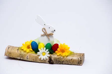 handmade wooden Easter rabbit on a white backgroundの写真素材