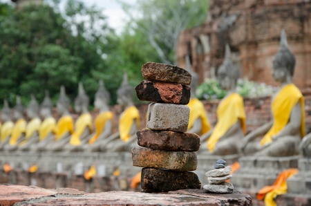 Stone with Row of Aged Buddha Imageの写真素材