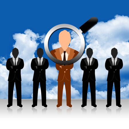 A Magnifying Glass Hovers and Zoom Over Brown Businessman for Job Opportunity Campaign の写真素材