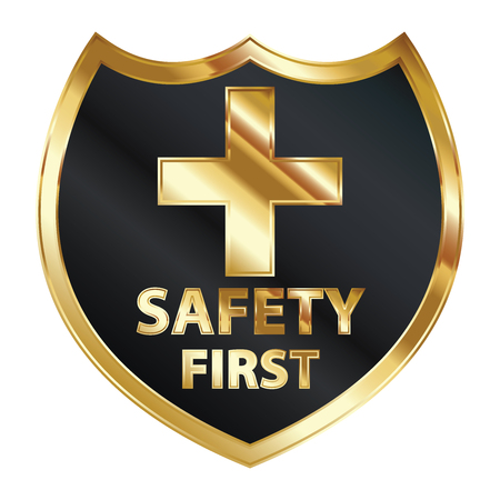 Safety First Concept, Black and Golden Metallic Style Shield With Golden Cross Sign and Safety First Text Isolated on White Backgroundの写真素材
