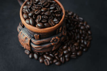 Juicy coffee beans on the texture in cupの写真素材