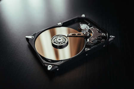 Opened hard drive from the computer (hdd) with mirror effects. Part of computer (pc, laptop)の写真素材