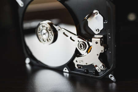 Opened hard drive from the computer (hdd) with mirror effects. Part of computer (pc, laptop)