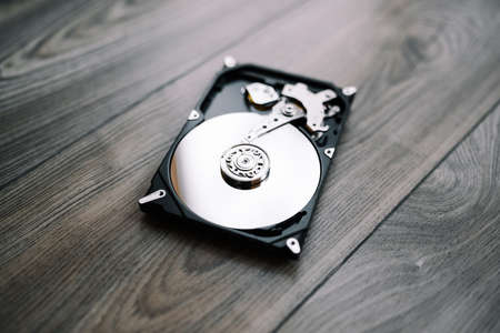 Opened hard drive from the computer (hdd) with mirror effects. Part of computer (pc, laptop)