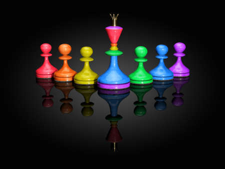 Chessmen of colour of a rainbow on a black background with reflexion.の写真素材