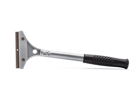 Metal wall paint scraper with black plastic handle isolated on white background.の写真素材