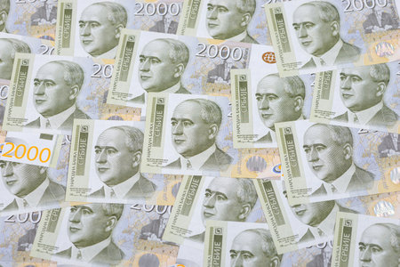 A heap of Serbian dinar paper currency, 2000 dinars value. Selective focus.