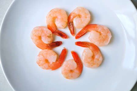 Cooked shrimps on white plateの写真素材