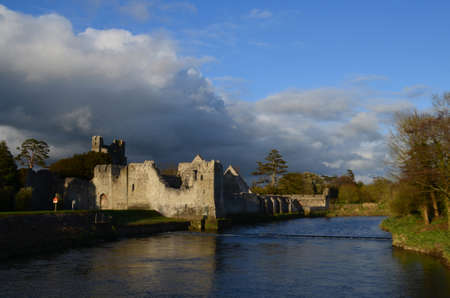 River maigue and ruins of Desmond Castle in Ireland.